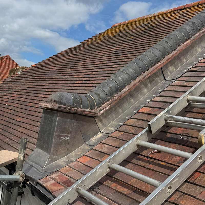 Lead flashing repair around half round brick parapet wall in Portsmouth